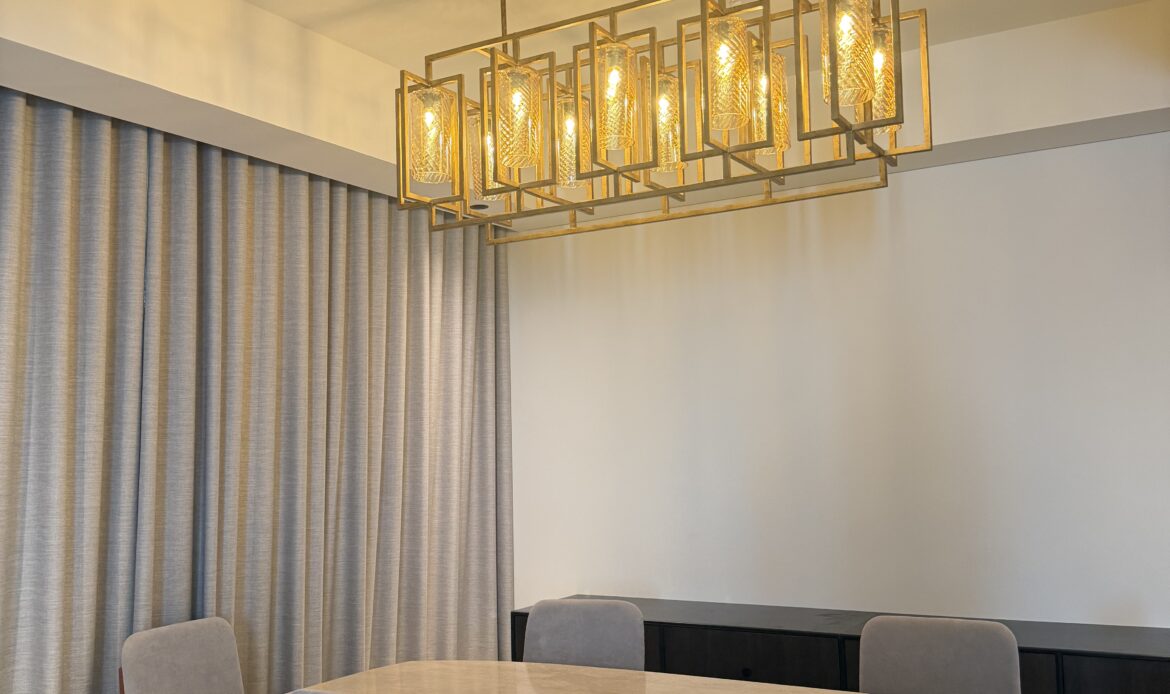 Side view of a contemporary dining area with wooden table and chairs